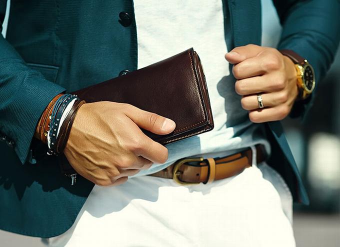 Man holding wallet and jacket